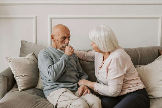 Two seated people wondering if air purifiers are effective